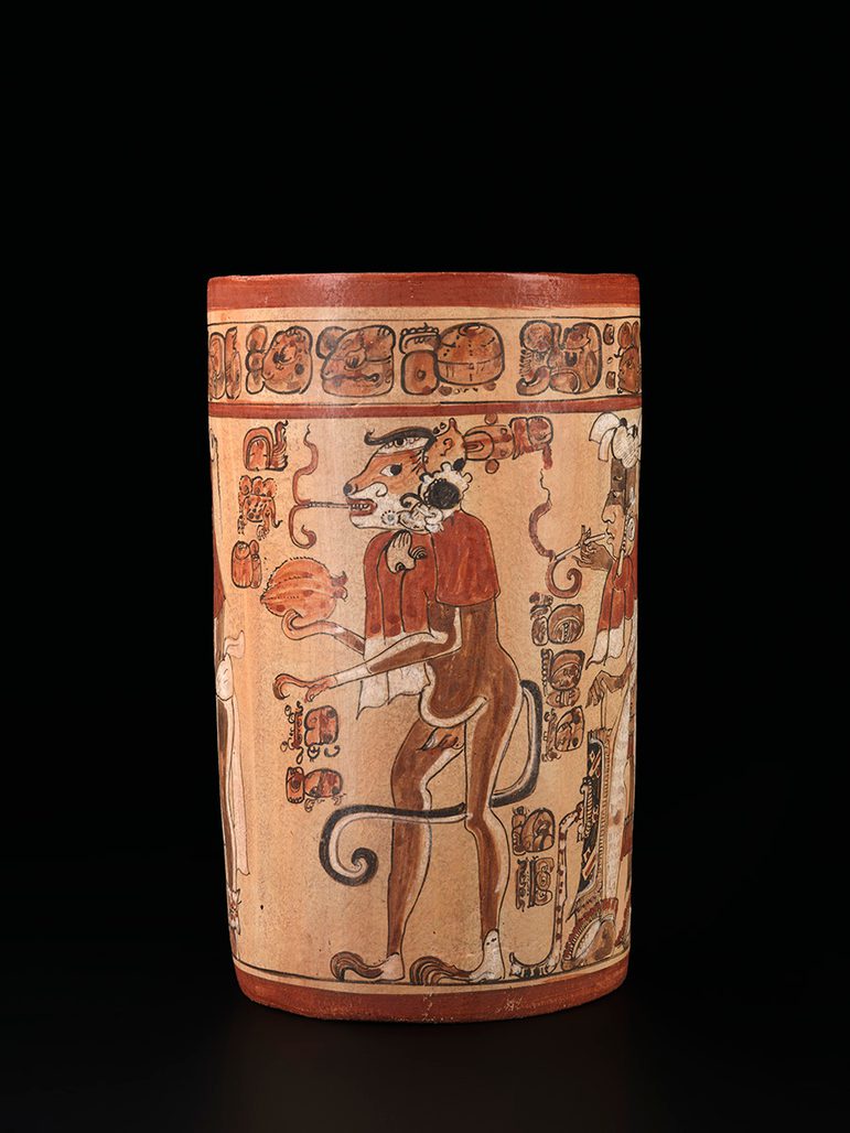 A modern replica of an ancient Mayan vessel. Features imagery of a monkey smoking tobacco.