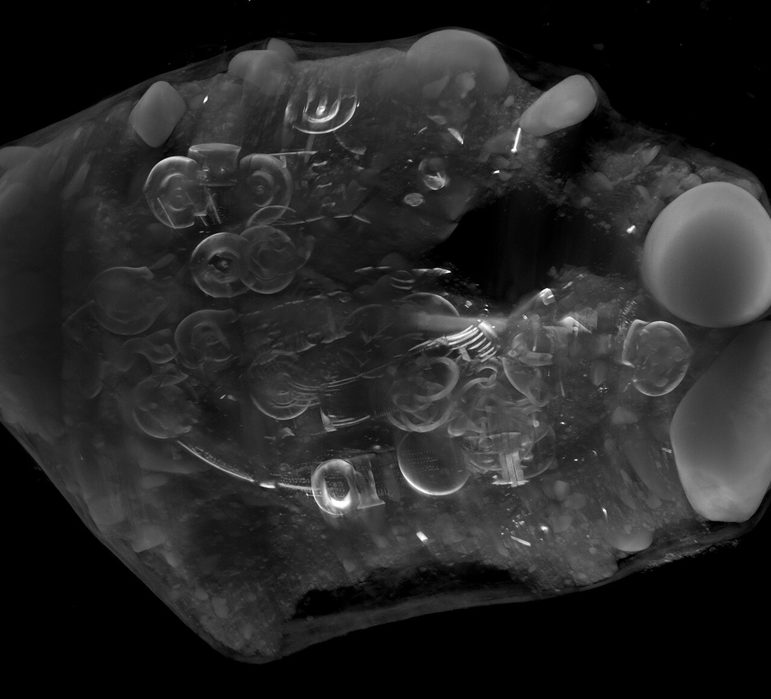 A black and white CT scan of the hoard, showing the layout of the several hundred objects within
