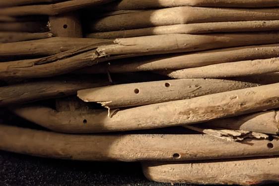 Close up of a damaged wooden basket.