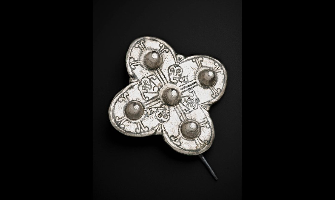 A small quatrefoil brooch.