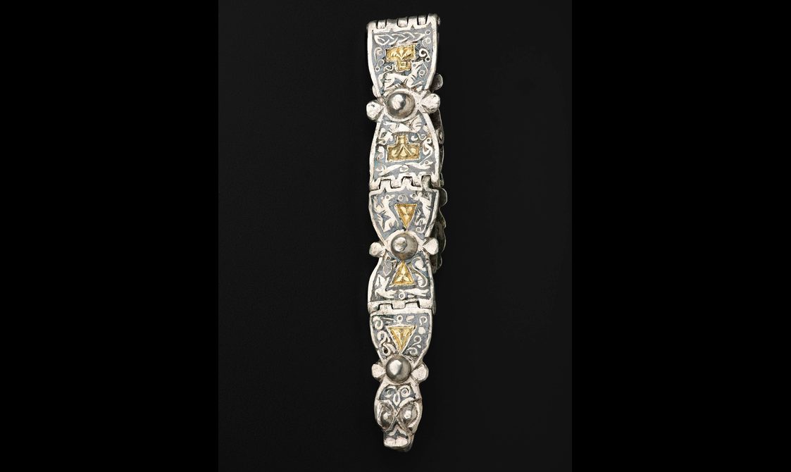 A hinged mount with Anglo-Saxon Trewhiddle-style decoration.