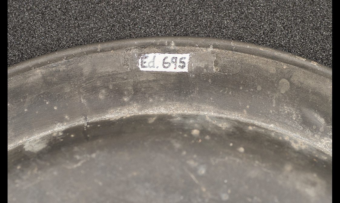 Close up of an object label applied with typing correction fluid.