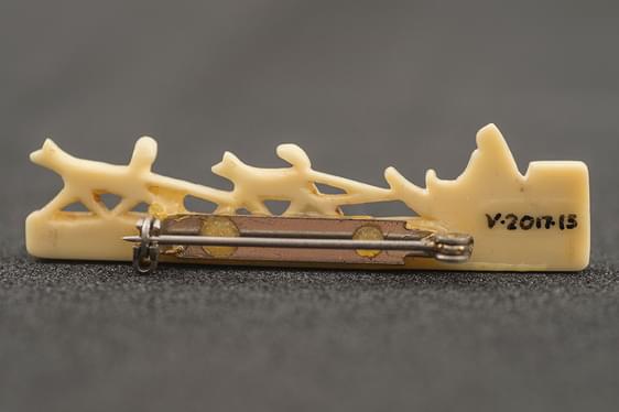 Close up of a written museum reference on an object.