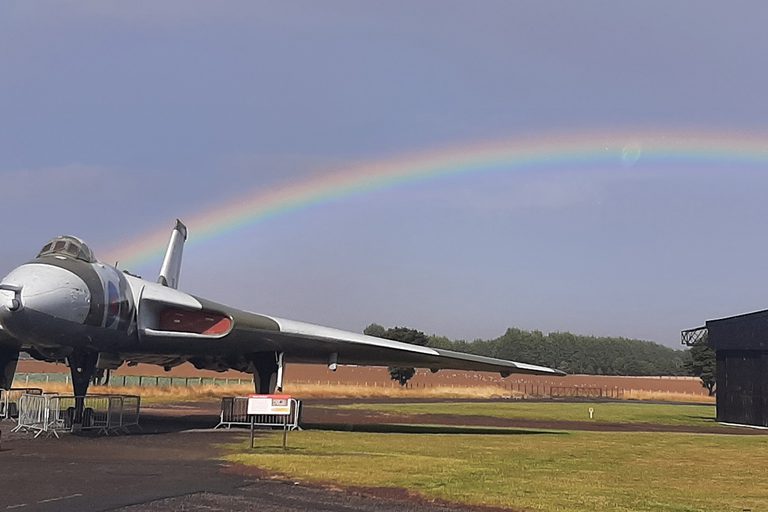 Plane on the tarmac of an airfield.