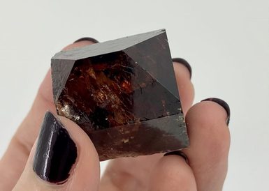 A dark brown crystal.