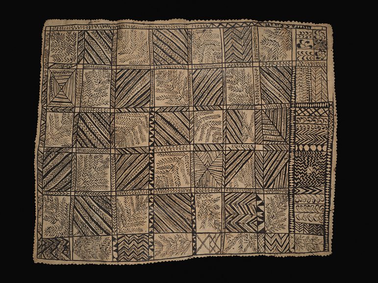 Tan coloured section from hiapo (barkcloth) painted with black outlines of geometric and naturalistic designs in a grid pattern.