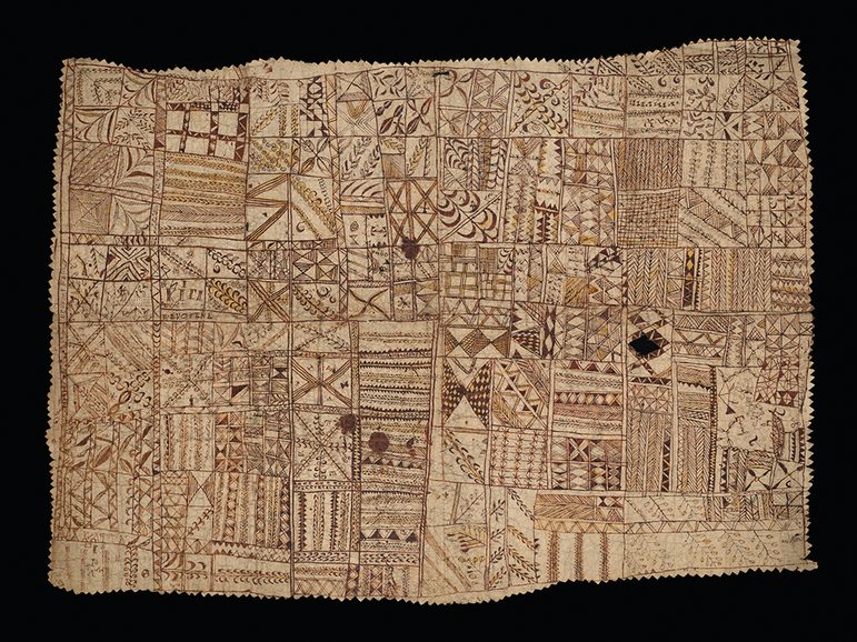 Tan coloured hiapo (barkcloth) painted with geometric and naturalistic designs and text with serrated edges.