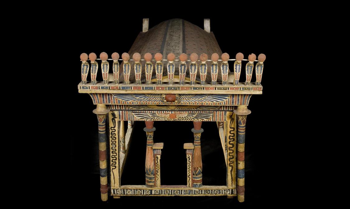 A canopy model in the shape of a shrine with an arched roof and corner-posts.