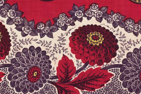 Four alternating red and black flowers with leafs set against wavy white background. Black floral motifs separate white and red backgrounds.