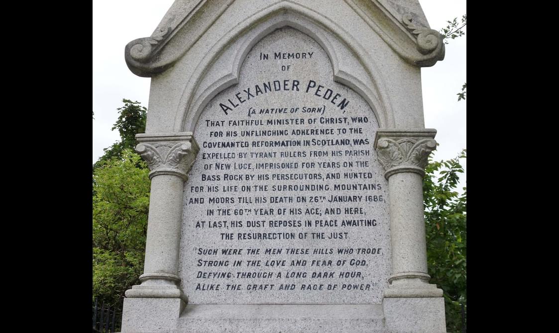 A large tombstone for Alexander Peden with a long inscription.