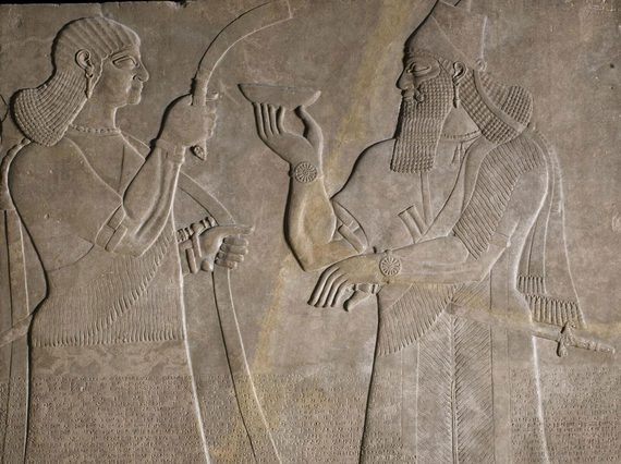 Stone panel depicting two human figures facing each other.