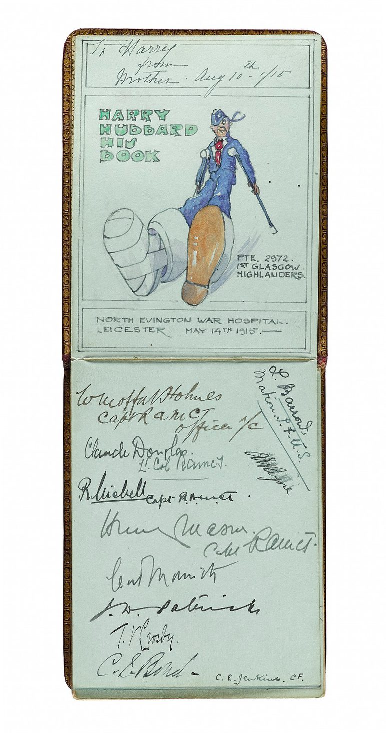 A light blue autograph book, with an image of a man sat down with a bandaged leg, with a series of autographs on the page beneath.