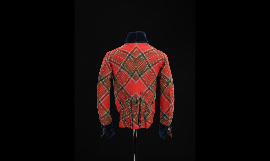 Back view of a mannequin wearing a red tartan jacket