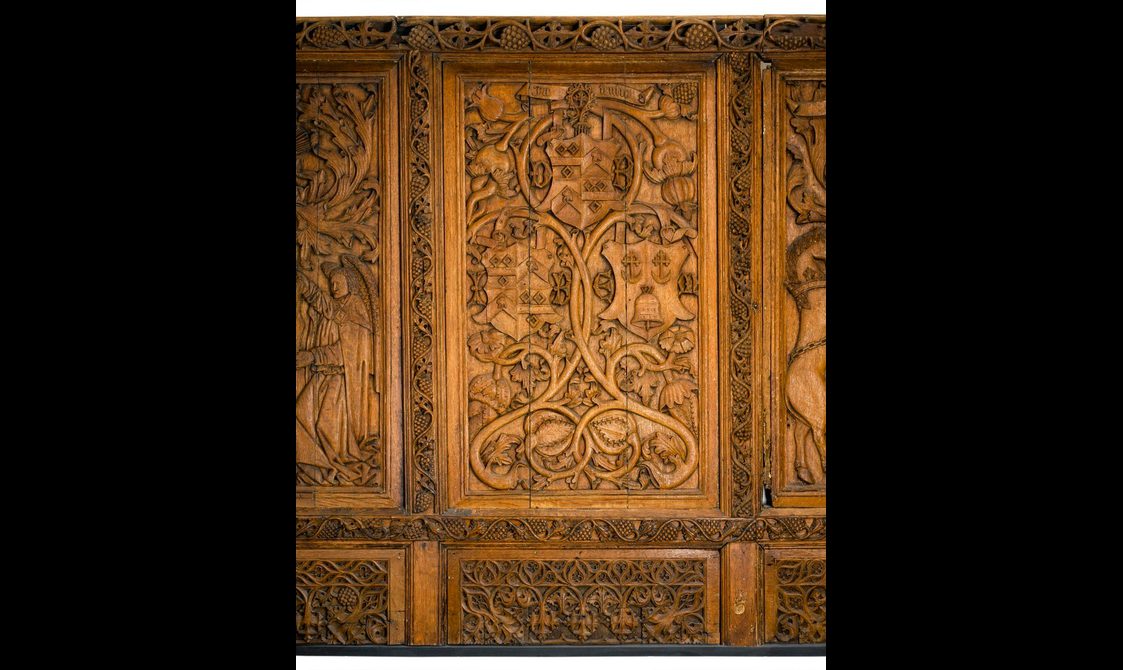 Carved oak panel depicting the armorial shields of Cardinal Beaton (top) and his parents (left and right).