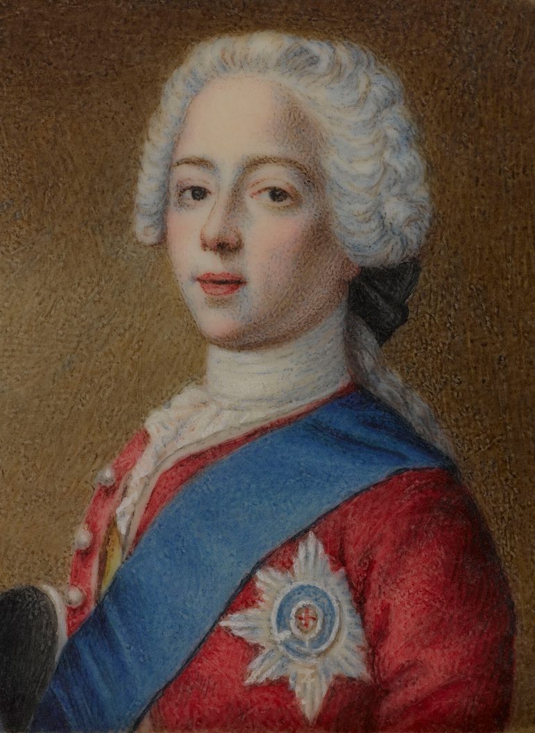 A detail of a bust portrait showing a young man turned sideways, wearing a white ruffled wig, red jacket with buttons, a star medal on the right hand side and a blue ribbon over his left shoulder.