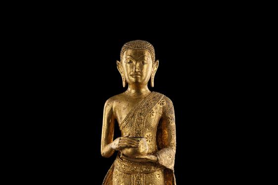 A Buddha sculpture holding an alms bowl.