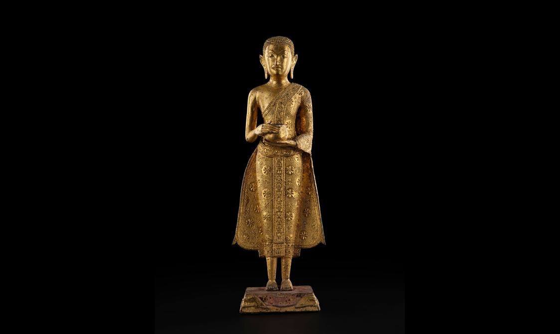 A Buddha sculpture holding an alms bowl.