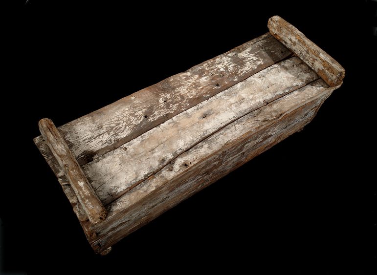 A weathered wooden rectangular box