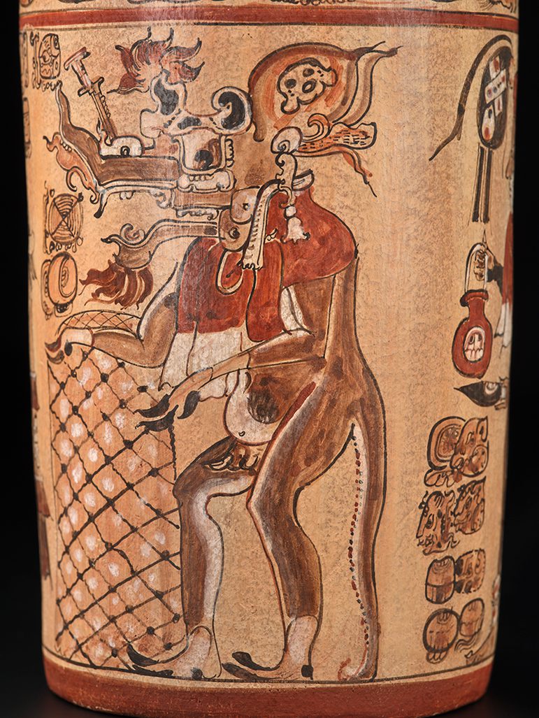 Mayan vase depicting a composite serpent deer figure playing a drum, surrounded by intricate symbols and glyphs.