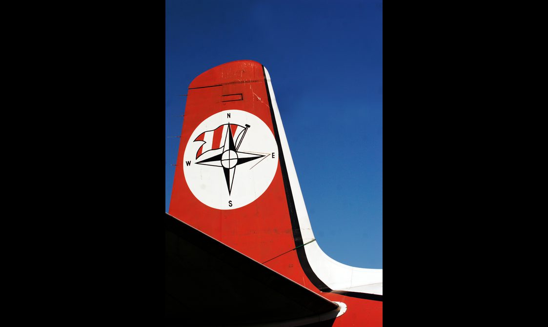A red and white aircraft tail fin