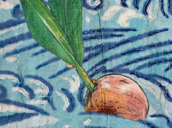 Kimono detail showing a germinating coconut.