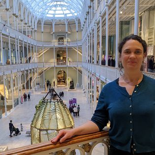 Dr Rebekah Higgitt standing in the grand gallery