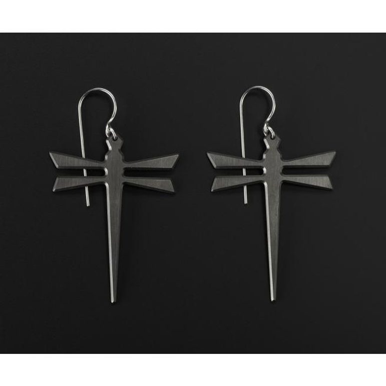 A pair of silver earrings in the shape of dragonflies
