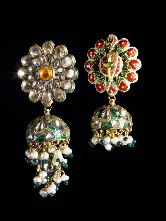 Ornate earrings set with multi coloured gemstones