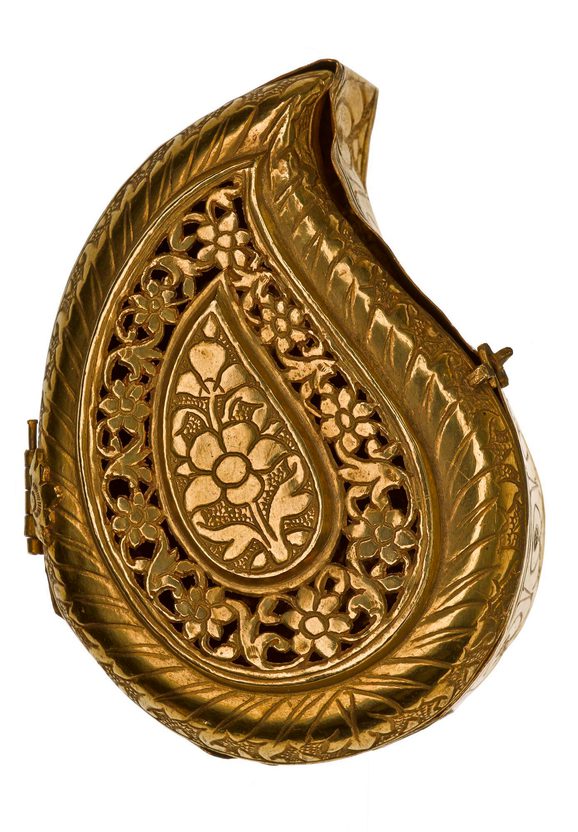 An intricately decorated golden tear-shaped box