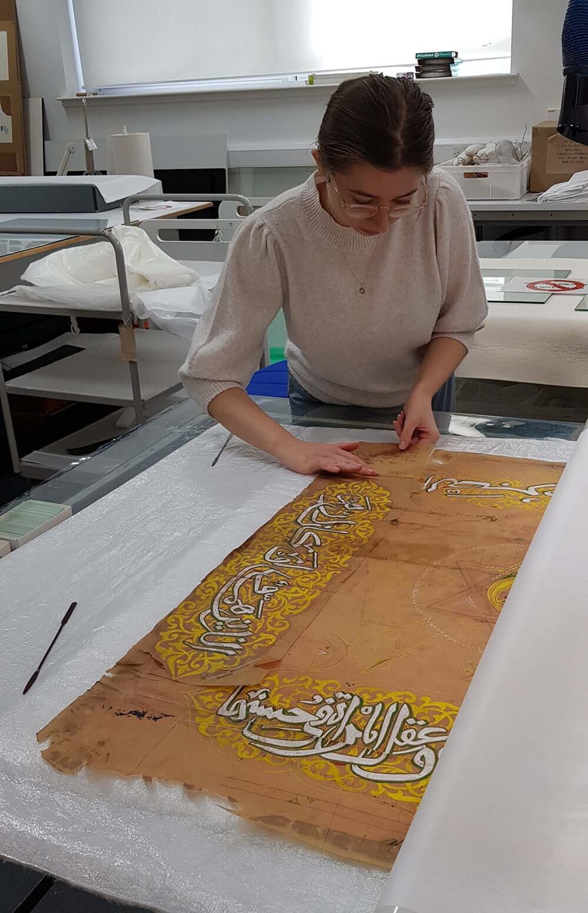 Emily Smoothing Out Tracing Paper During Humidification