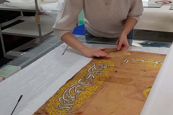 Emily Smoothing Out Tracing Paper During Humidification