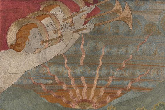 A detail of an embroidery featuring three angels with gold halos blowing trumpets with a sun setting in the background
