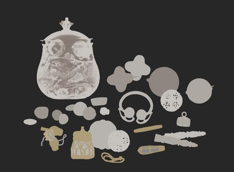 An X ray scan of a group of objects set against black background.