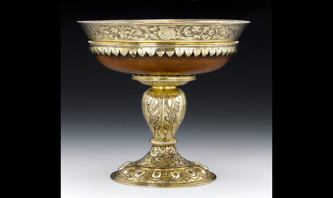 A gold and wood goblin with intricate floral details