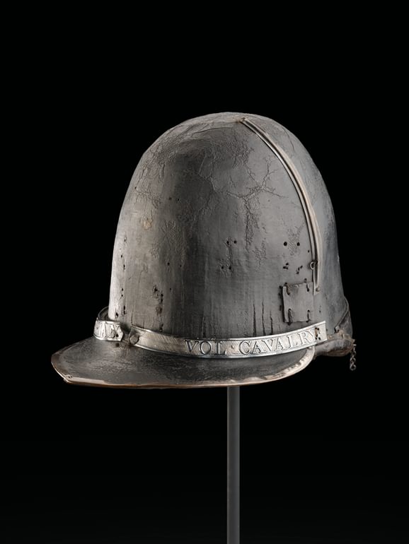 A helmet with the words 'vol cabulary' on a band above the rim