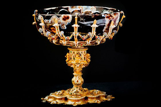 A goblet with an elaborate golden foot and a marbled bowl