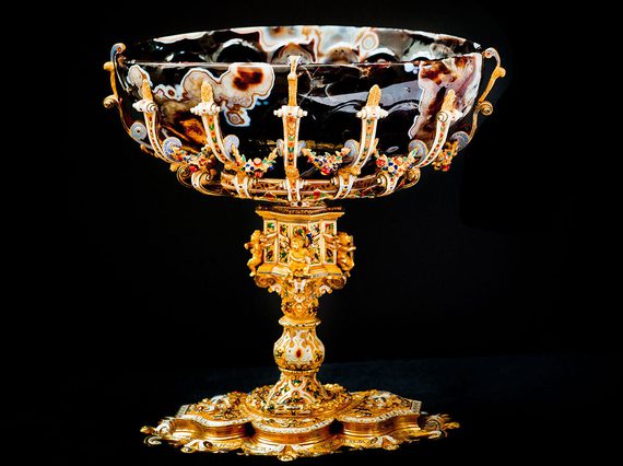 A goblet with an elaborate golden foot and a marbled bowl