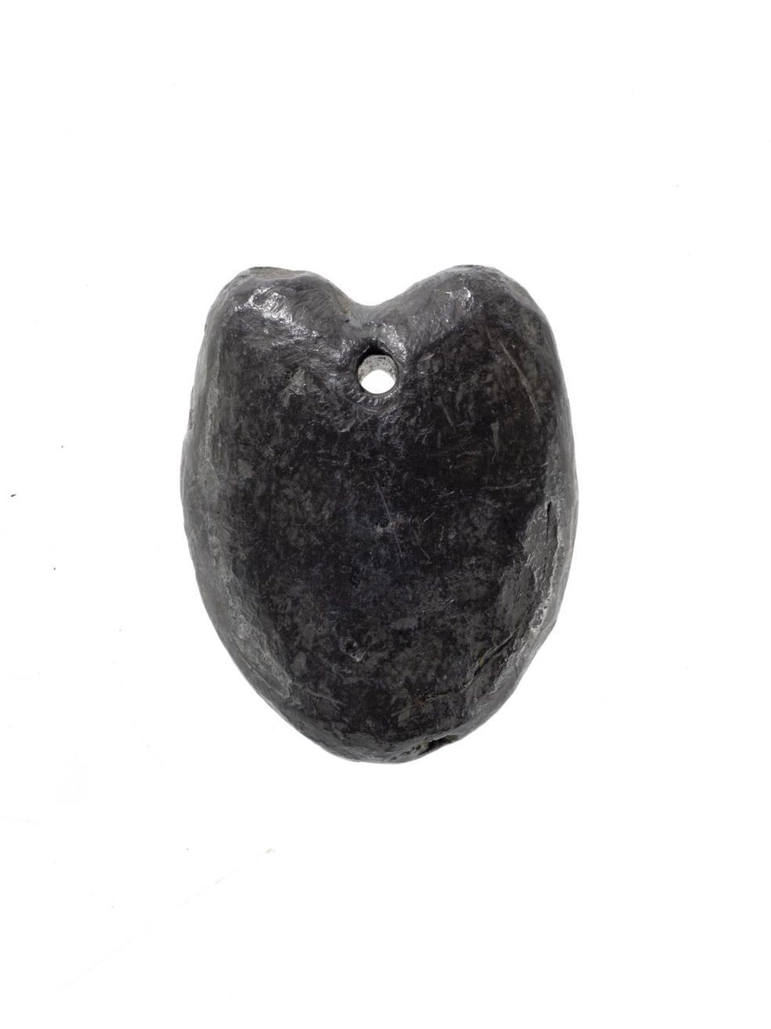 Heart shaped charm made from cast lead, with a perforated hole for suspension.