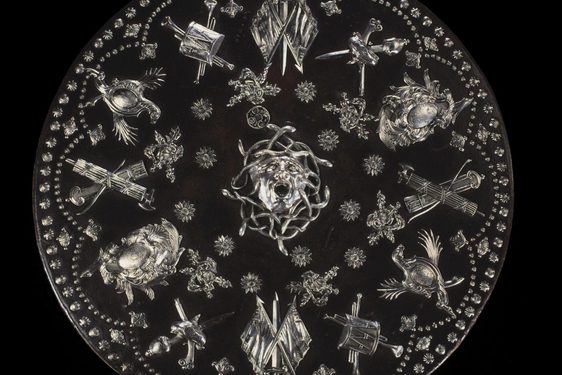 Highly decorated Jacobite round shield or targe with silver mounts. Medusa's face is in the centre surrounded by quivers, flags, swords and guns.