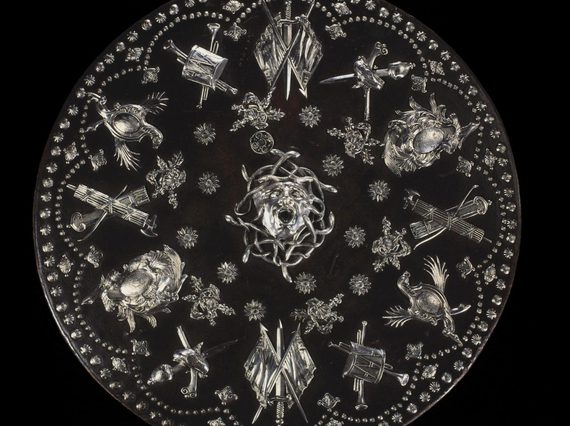 Highly decorated Jacobite round shield or targe with silver mounts. Medusa's face is in the centre surrounded by quivers, flags, swords and guns.