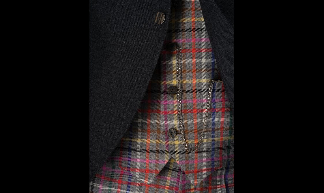 A colourful tartan waistcoat with a pocket watch chain