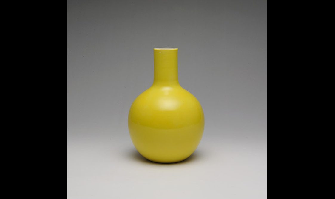 A yellow porcelain vase