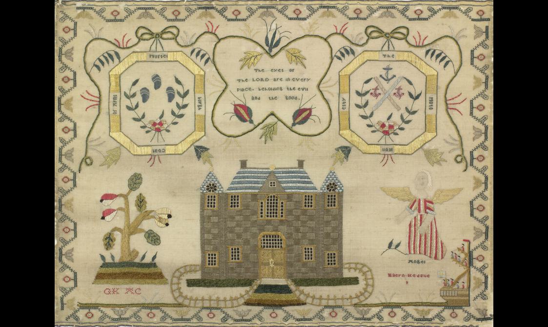 A needlework sampler with a castle in the middle next to an angel and a plant. Above are two family crests beside a Bible verse that reads, "The eyes of the LORD are in every place, beholding the evil and the good."