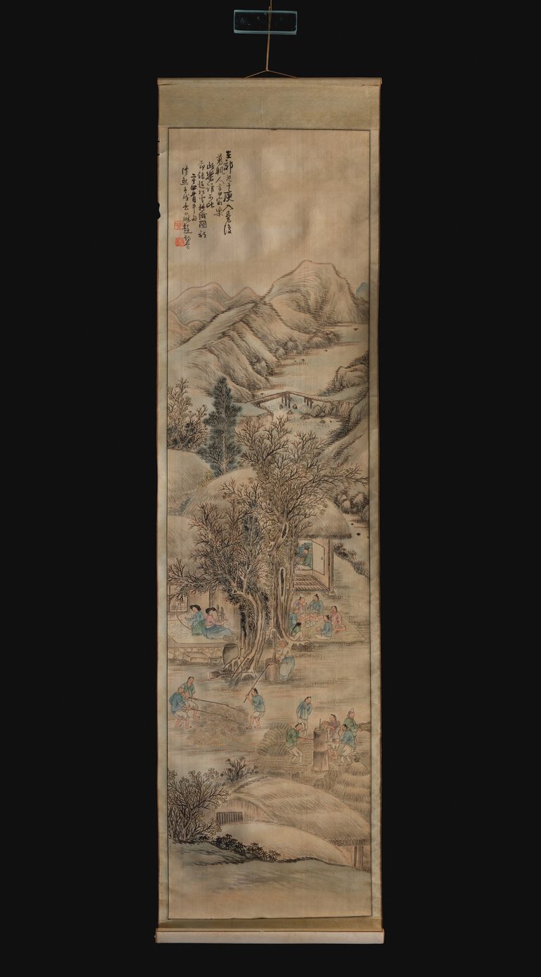 A full paper scroll with illustrations of an outdoor village scene with mountains in the background and writing in the upper left corner.
