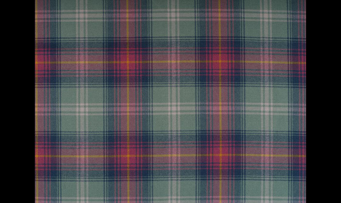A tartan textile in pink, purple, and green check pattern