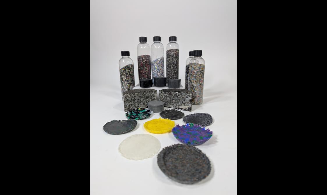6 bottles containing small coloured plastic particles, and a collection of plastic shaped discs.