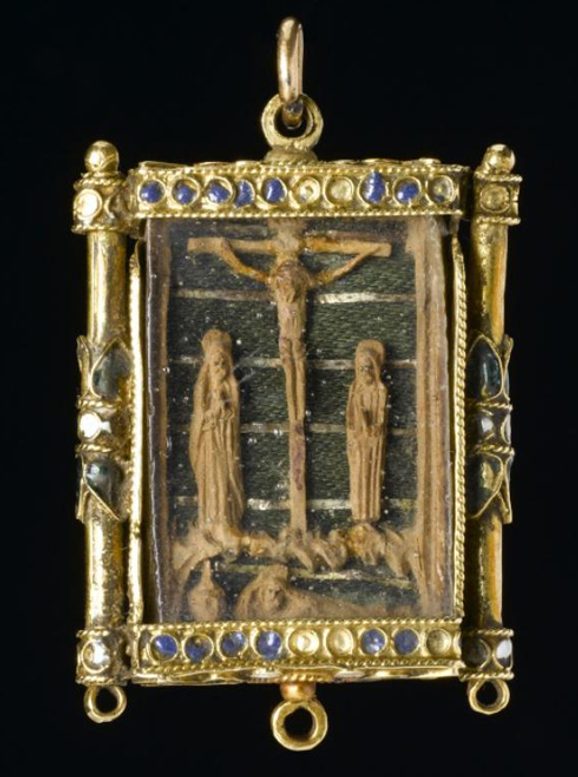 A rectangular gold locket depicting Jesus Christ on the cross.