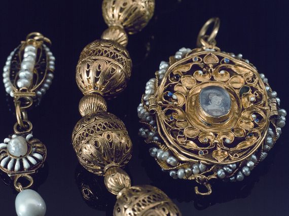 Elaborately decorated pendant, necklace, and locket made of gold, pearls, and other precious gems