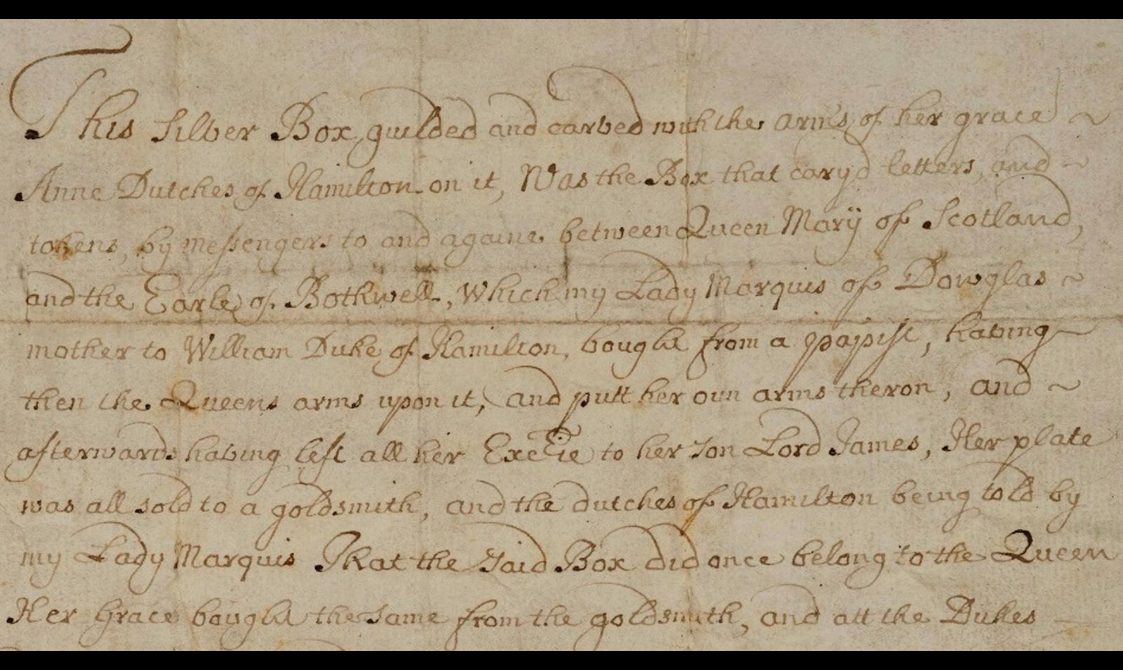 Closeup of faded black semi-cursive script on aged paper discussing the ownership of the silver casket.