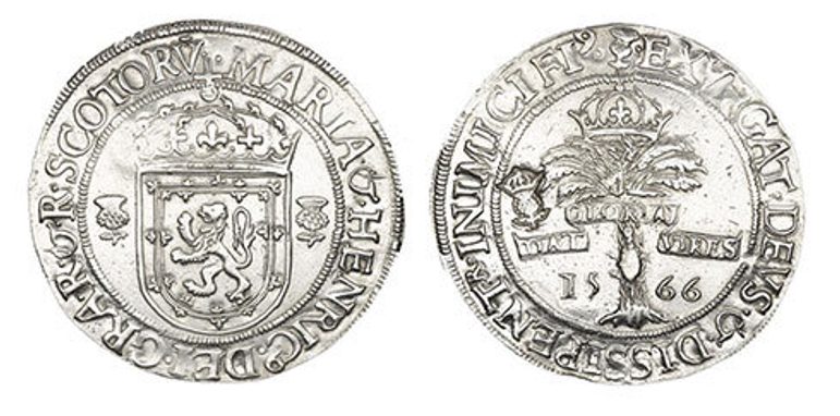 Two silver coins imprinted with a royal crest with letters around the circumference